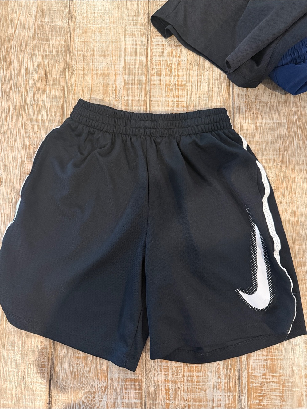 Nike Black Shorts with White Swoosh and Side Trim